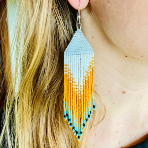 Matte white and orange fringe seed bead earrings