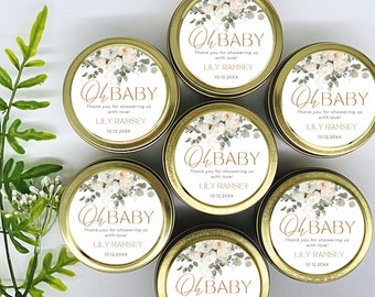 May include: Six gold favor tins with white labels featuring a floral design and the text "Oh Baby!"  Thank you for showering us with love! Lily Ramsey 10.12.20XX