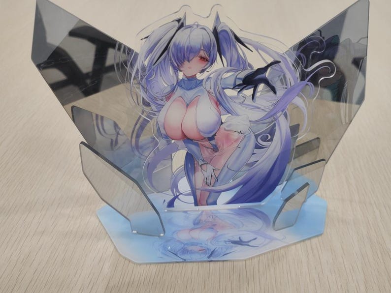 May include: A clear acrylic anime figure featuring a female character with long, flowing lavender hair and red eyes. The figure is supported by a light blue base and a clear, angular backdrop. The character is depicted in a dynamic pose.