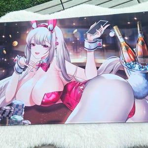 May include: A large rectangular gaming mousepad featuring a cartoon illustration of a woman in a bunny outfit, playing cards. The background includes casino chips, champagne bottles, and gold coins. The color palette is dominated by pink, white, and gold.