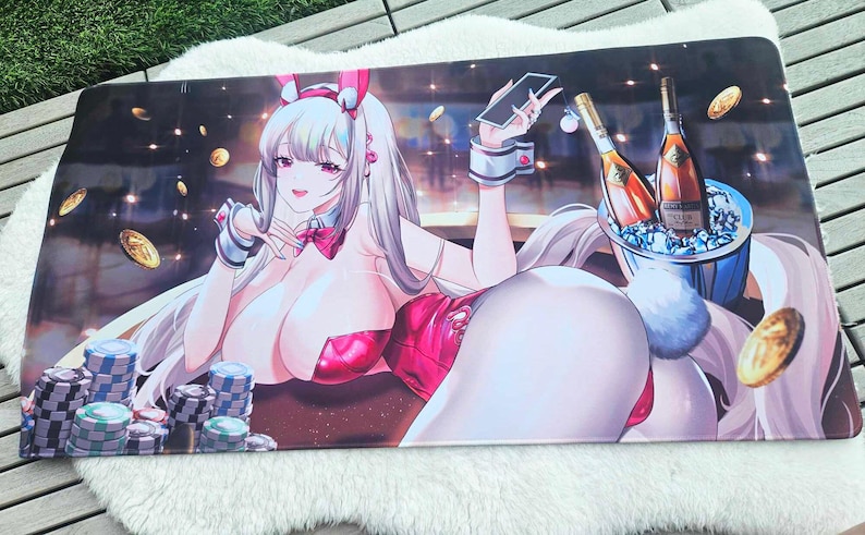 May include: A large rectangular gaming mousepad featuring a cartoon illustration of a woman in a bunny outfit, playing cards. The background includes casino chips, champagne bottles, and gold coins. The color palette is dominated by pink, white, and gold.