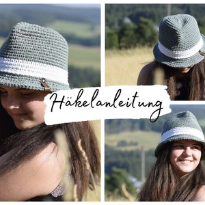 May include: A crocheted hat in a light green color with a white band and a brown leather strap. The hat is being worn by a person in a field with a green background. The text "Häkelanleitung" is visible in the image.
