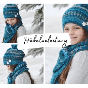 May include: A blue and grey crocheted hat and scarf set with white snowflake embellishments. The set is shown on a young person in a winter setting. The image includes the text "Häkelanleitung" which is German for crochet instructions.