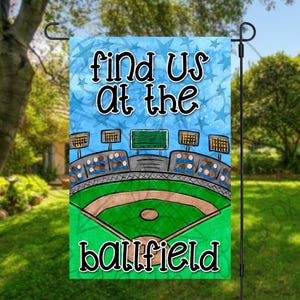 May include: A blue and green garden flag with a baseball field and the text "Find us at the ballfield".