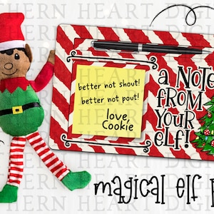 May include: A red and white striped sign with the text "a Note FROM Your elf!" and a yellow sticky note with the text "better not shout! better not pout! love, Cookie". A plush elf doll with a red hat, green shirt, and red and white striped pants is standing next to the sign. A green Christmas tree with red and gold ornaments is on the sign.