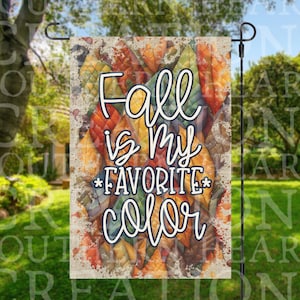 May include: A fall-themed garden flag with a rustic background of colorful autumn leaves. The text reads "Fall is my favorite color".