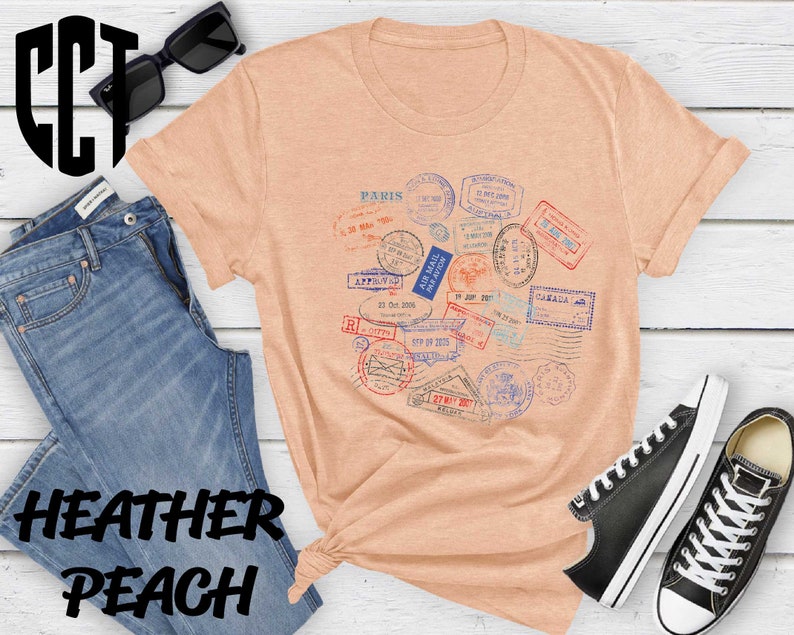 a t - shirt with a bunch of stamps on it
