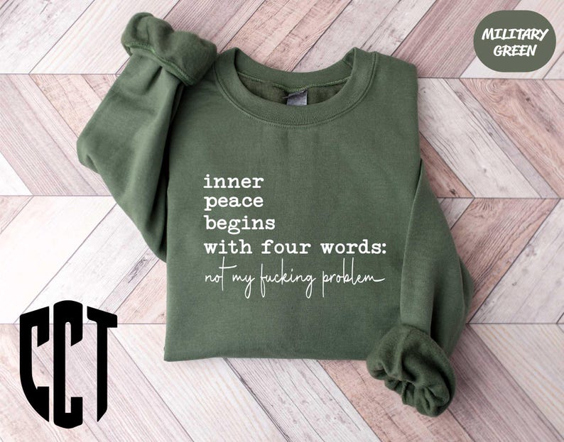 a green sweatshirt with white writing on it