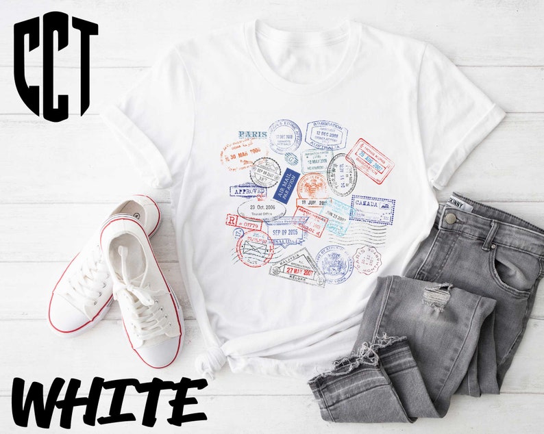 a white t - shirt with a bunch of stamps on it