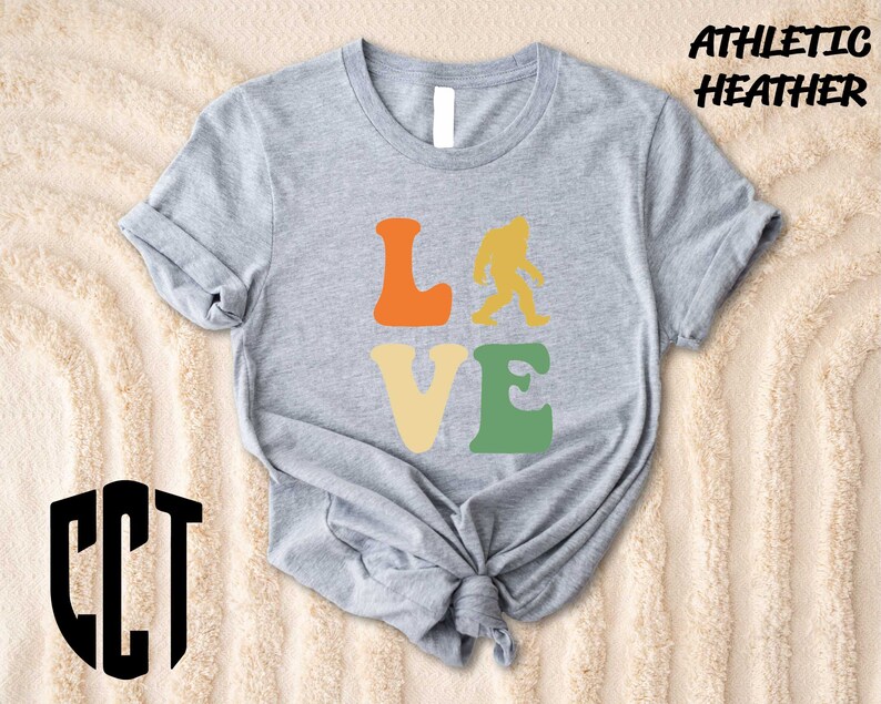 a t - shirt that says love with a bigfoot on it