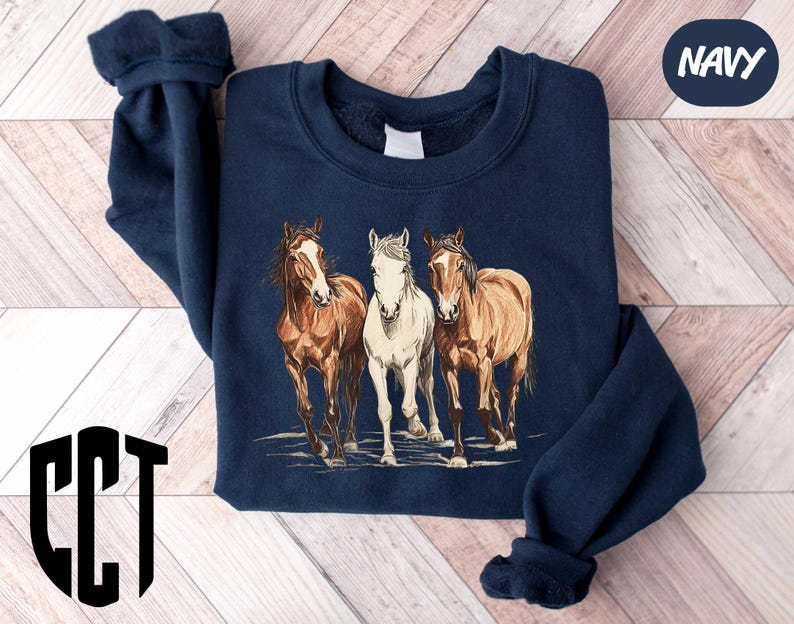a group of horses standing next to each other on a wooden floor