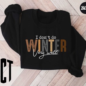 a black sweatshirt with the words i don't do winter pay suicide on it