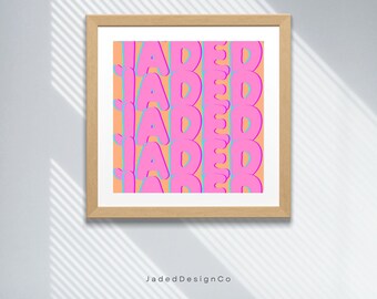 May include: A framed print with a repeating pattern of the word "Jaded" in pink and blue letters on a peach background.