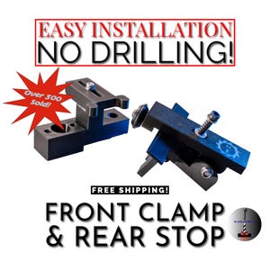 May include: Black plastic front clamp and rear stop for a woodworking machine. The text "EASY INSTALLATION NO DRILLING!" is in red letters. The text "Over 300 Sold!" is in red letters on a white starburst. The text "FREE SHIPPING!" is in black letters. The text "FRONT CLAMP & REAR STOP" is in black letters.