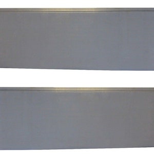 May include: Two identical, rectangular, silver-colored metal panels. Each panel has a slightly angled edge and a notched section on one end. The panels are likely components of a larger structure or product.