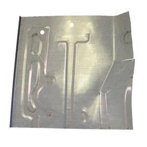 May include: A sheet of silver-colored metal with cut-out patterns and two small holes. The metal has a slightly textured surface and appears to be a component or part of a larger structure. The edges are cut at angles.