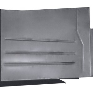 May include: A gray metal car floor panel replacement part. The panel has a rectangular shape with a curved edge and several raised lines.