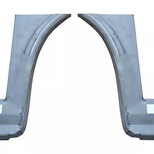 May include: Two metal car wheel arch repair panels. The panels are shaped like a quarter circle and have a flat base.