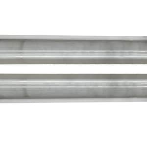 May include: Two silver-colored metal car rocker panels, viewed horizontally against a white background. Each panel has a rectangular shape with a curved edge on one end and a stepped design.