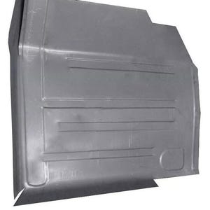 May include: A new, unpainted, gray metal panel with a series of horizontal and vertical lines. The panel has a curved edge and a rectangular shape, likely a vehicle part.