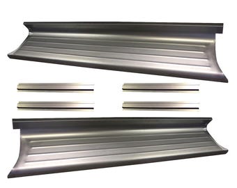May include: Silver-colored metal running boards and trim pieces. The running boards have a ribbed design and curved ends. The trim pieces are rectangular and have a black stripe. The items are likely for a vehicle.