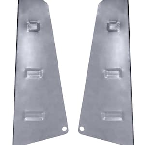 May include: Two metal panels with multiple rectangular cutouts. The panels are silver in color and have a slightly curved shape.