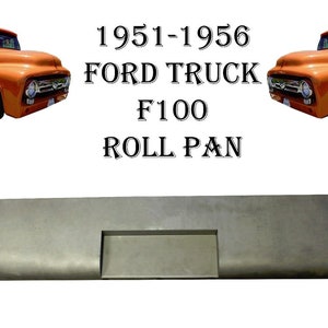 May include: A metal roll pan for a 1951-1956 Ford F100 truck. The pan is gray and has a rectangular opening in the center.