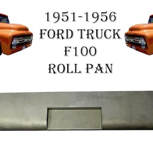 May include: A metal roll pan for a 1951-1956 Ford F100 truck. The pan is gray and has a rectangular opening in the center.