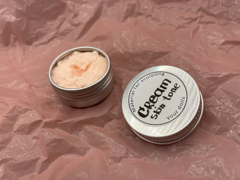 Modeling paste, craft supplies, customizing tools, and a UV lamp for doll face making. Modeling paste is often used to sculpt facial features, while customizing tools can be used to add details like lips or eyeshadow.