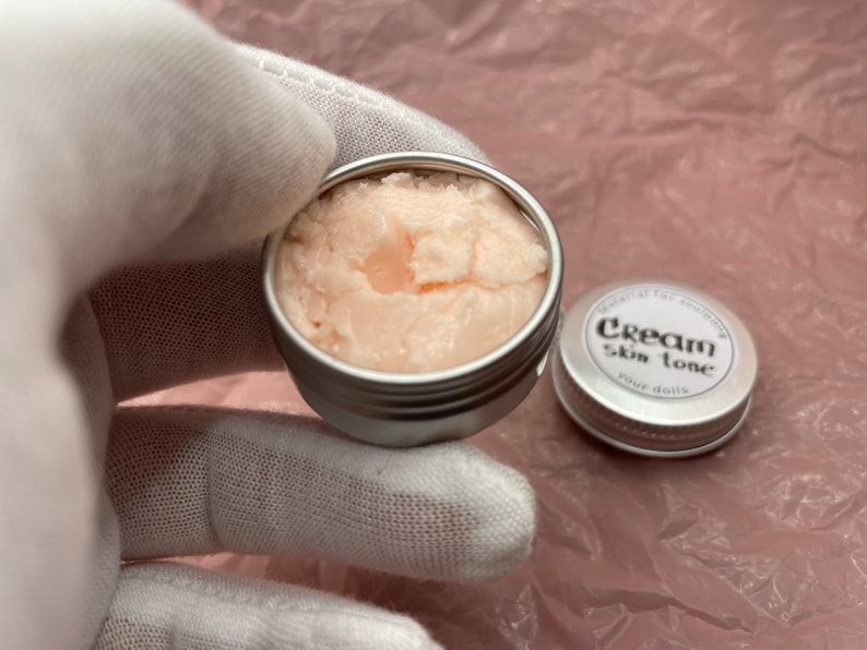 Modeling paste, craft supplies, customizing tools, and a UV lamp for doll face making. Modeling paste is often used to sculpt facial features, while customizing tools can be used to add details like lips or eyeshadow.