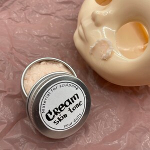 Modeling paste, craft supplies, customizing tools, and a UV lamp for doll face making. Modeling paste is often used to sculpt facial features, while customizing tools can be used to add details like lips or eyeshadow.