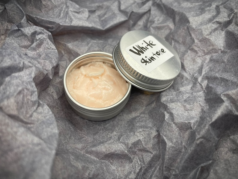 Modeling paste, craft supplies, customizing tools, and a UV lamp for doll face making. Modeling paste is often used to sculpt facial features, while customizing tools can be used to add details like lips or eyeshadow.