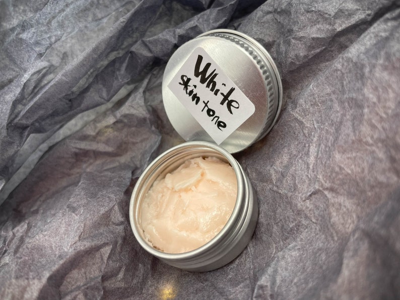 Modeling paste, craft supplies, customizing tools, and a UV lamp for doll face making. Modeling paste is often used to sculpt facial features, while customizing tools can be used to add details like lips or eyeshadow.
