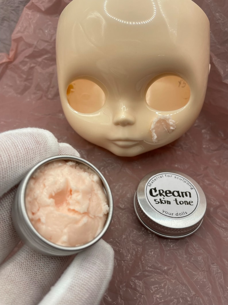Modeling paste, craft supplies, customizing tools, and a UV lamp for doll face making. Modeling paste is often used to sculpt facial features, while customizing tools can be used to add details like lips or eyeshadow.