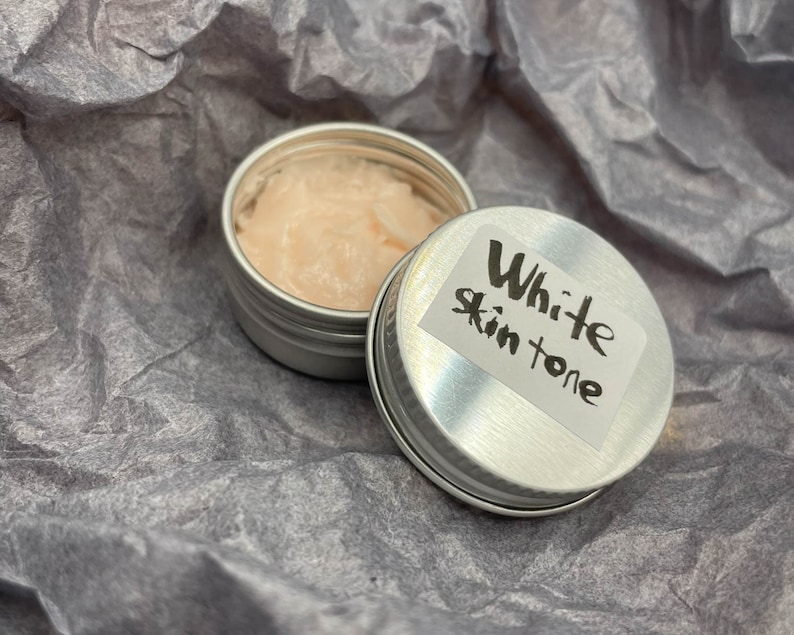 Modeling paste, craft supplies, customizing tools, and a UV lamp for doll face making. Modeling paste is often used to sculpt facial features, while customizing tools can be used to add details like lips or eyeshadow.