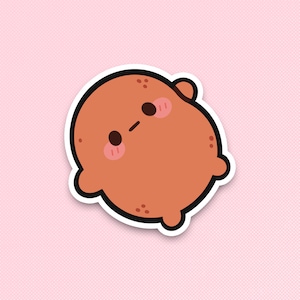 May include: A cartoon illustration of a brown, round character with a cute, surprised expression. The character has large eyes and a small mouth. The character is outlined in white.