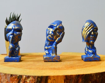 Abstrakte Gesichter sehen, hören, sprechen No Evil Statue