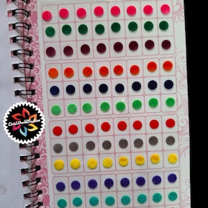 May include: A spiral bound book with a variety of colors of round, felt stickers. The book is titled "Ananya Kumkum Bindi" and "Spiral Book".
