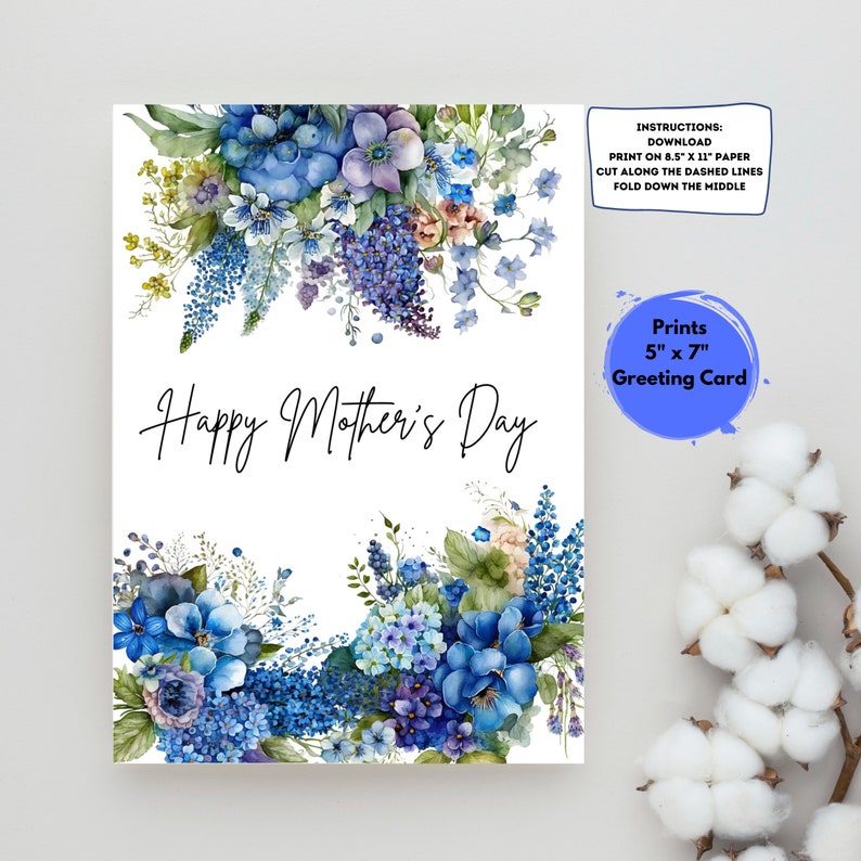 May include: Printable greeting card featuring a watercolor illustration of blue and purple flowers with the text "Happy Mother's Day". The card is designed to print on 8.5 x 11 inch paper and fold in half to create a 5 x 7 inch card.