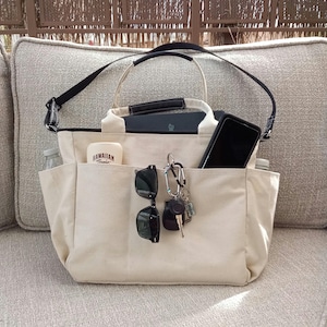 Large capacity 10 pocket tote for everything. Stylish bag for travel, work or school  with zipper coin purse, holds all you need.