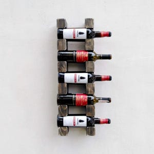 Solid wood hanging wine rack for 5 bottles. Wall mounted wooden wine holder. Home Bar Bottle shelf with hidden mount. Rustic wine rack