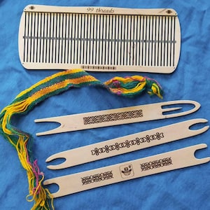 May include: A wooden loom with 99 threads, a woven tapestry in green, yellow, and pink, and three wooden weaving needles with intricate designs.