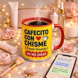 May include: A yellow ceramic mug with a red interior and handle, featuring the text "CAFECITO CON CHISME", a red heart icon, a small mug icon, the text "Fresh Gossip", and a red banner with the text "NO ME DIGAS" in white letters.