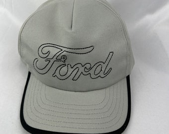 May include: A gray baseball cap with a black brim and a black embroidered Ford logo.