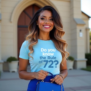 May include: A light blue t-shirt with the text "Do you know the Rule of 72?" is worn by a person. The person is holding a blue purse. The background features a building with an arched doorway.
