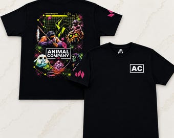 May include: A black short-sleeve t-shirt featuring a graphic print on the back and front. The back displays a colorful digital scene with creatures, the text ANIMAL COMPANY VR, and pink crystals. The front features a white box with the letters AC.
