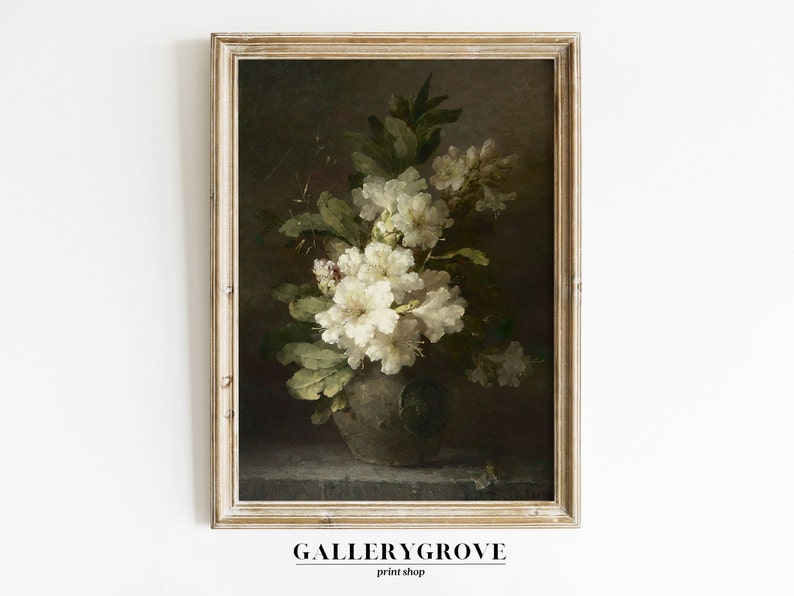 May include: A framed painting of a still life featuring a vase of white flowers with green leaves against a dark background.