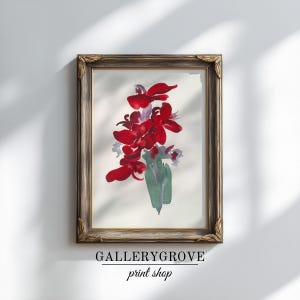 May include: A framed watercolor painting featuring vibrant red flowers with green stems and light purple accents on a white background. The artwork is enclosed in a dark, ornate wooden frame with decorative corner details and gold inner trim.