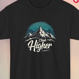 May include: Black t-shirt with a graphic of a mountain range with stars and the text "Climb Higher" in white.