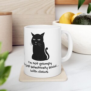Grumpy Black Cat Ceramic Mug, Funny Cat Lover Gift, Selectively Social Mug, Clawed Cat Coffee Cup, 11oz 15oz